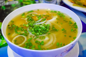 Tasty vietnamesse soup with seafood and noodles
