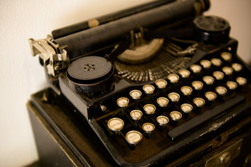 Ancient typewriters placed on old wooden tables The machine can print normally.