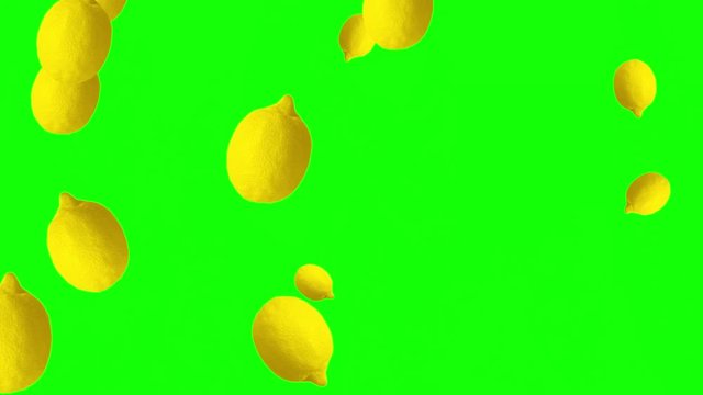 Lemons falling against green background. Health concept