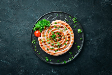 Grilled sausages with spices and herbs. BBQ Top view. Free space for your text.