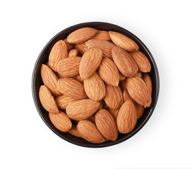 Almonds in a black cup isolate on a white background. Top view