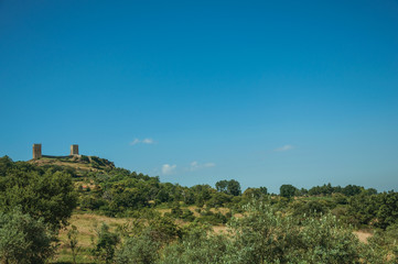 Fototapeta na wymiar Hilly landscape with the towers of castle