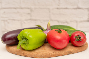 fresh vegetables (tomatoes, cucumbers, garlic, pepper, eggplant) for cooking