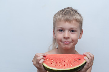 candid portrait of a boy with a watermelon