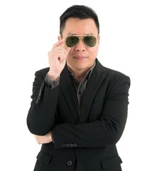 Portrait of businessman is happy and put sunglass isolated on white background