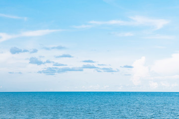 Empty vast blue ocean horizon and clear sky slightly clouds in summer