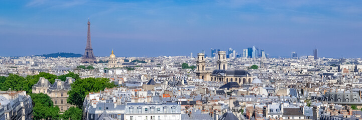 Fototapeta na wymiar Paris, typical roofs, aerial view with the Eiffel Tower and the Saint-Sulpice church in background 