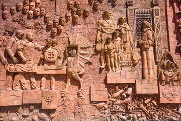 Fototapeta na wymiar Detail of the Soviet-era relief on wall of city market in Kutaisi, Georgia