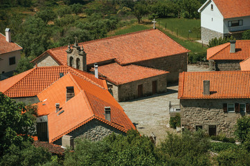 Hilly landscape with the roofs from village