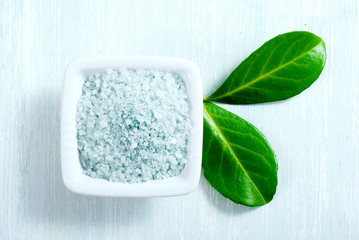 blue bath salt on old white wood table