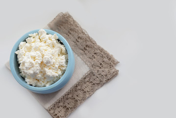 fresh cottage cheese in a blue bowl