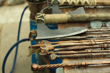 Axes, knives, coins, souvenirs and other goods, street exhibition of forging metal.