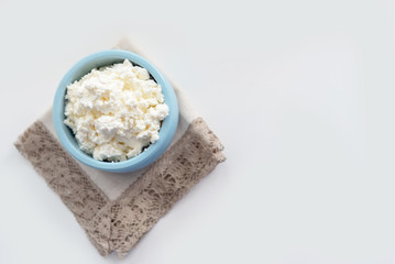fresh cottage cheese in a blue bowl