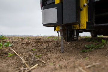Soil Sampling. Automated probe for soil samples taking sample with soil probe sampler. Environmental protection, organic soil certification, research.