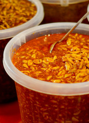 Closeup view of Indian Garlic pickle, display for sale by street vendor      