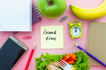Healthy organic snack from take away lunch box at workplace during time break. Container food at work. Top view