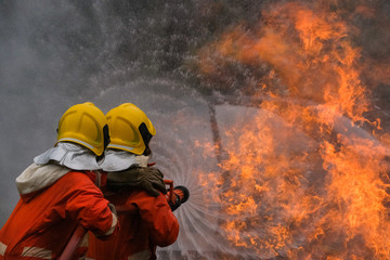 Firefighter are using water in fire fighting operation