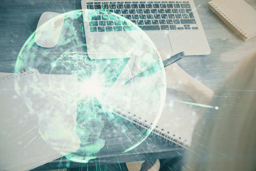 International business hud over woman's hands writing background. Concept of hard work. Double exposure