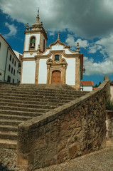Church in baroque style with steeple and staircase