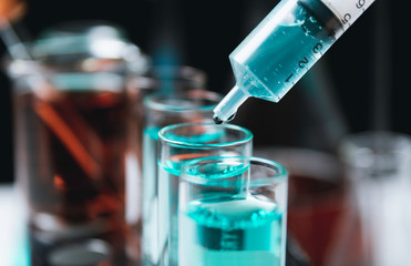 Glass laboratory chemical test tubes with liquid for analytical , medical, pharmaceutical and scientific research concept.