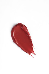 Smears red lip gloss isolated. Swipes lipstick on white background. Smudged makeup cosmetic product sample. - Image