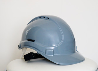 Fototapeta premium Gray safety helmet with plastic top on white background