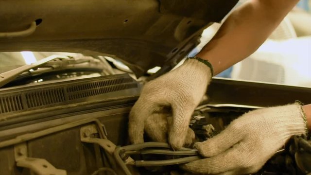 Man asian Checking Inspection period with car engine in showroom of   thai for automotive automobile car service image