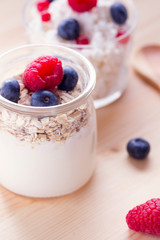 homemade yogurt in a jar of cereal and berries