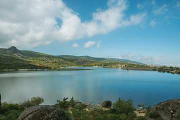 Blue water at the Rossim Lake with dam