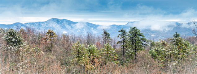 Beautiful panoramic image of the Blue Ridge Mountains in the winter with snow on the hills.