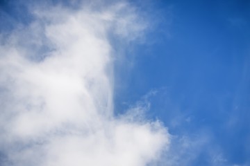 Beautiful white soft fluffy cirrocumulus clouds on a blue sky background