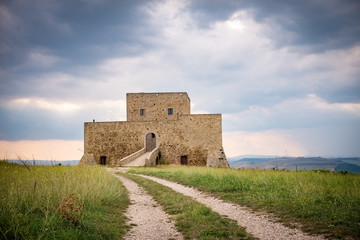 Fototapeta na wymiar Wonderful view of Monteserico castle on a stormy day. Genzano di Lucania - Basilicata, Italy