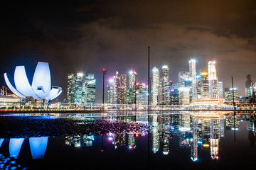 SINGAPORE, SINGAPORE - MARCH 2019: skyline of Singapore Marina Bay at night downtown core...
