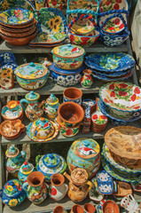 Fototapeta na wymiar Colorful handmade porcelain pots and dishes