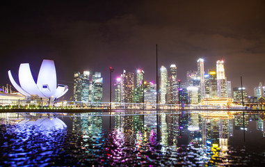 SINGAPORE, SINGAPORE - MARCH 2019: skyline of Singapore Marina Bay at night downtown core...