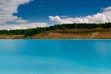 Beautiful turquoise lake in Novosibirsk. Dangerous lake with waste from  the Novosibirsk thermal...