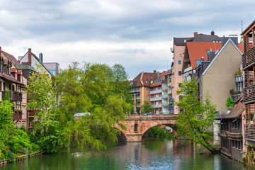 Fototapeta premium Stone bridge over the river in old Nuremberg