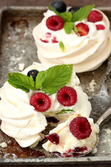 Mini Pavlova cakes with fresh berries