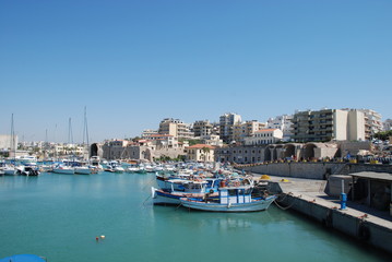 Street on the pier with yachts in the resort town of Heraklion, Crete