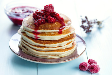 Healthy breakfast,homemade classic pancakes with fresh raspberry jam.
