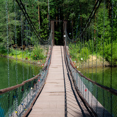 Blue lake in forest, Russian landscapes, beautiful nature. Beautiful bridge.