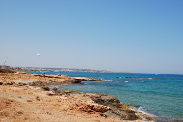 Fototapeta na wymiar Beautiful view of the Mediterranean Sea and rocky shore under the blue sky