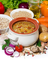 healthy lunch, soup with beans and vegetables on a white background, vertical