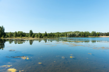 Fototapeta na wymiar Blue lake in forest, Russian landscapes, beautiful nature