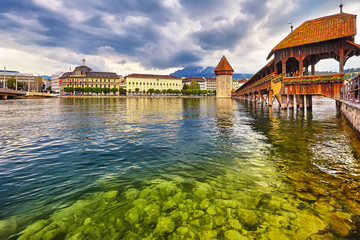 Fototapeta na wymiar Lucerne, Switzerland - Famous wooden Chapel Bridge, oldest wooden covered bridge in Europe. Luzern