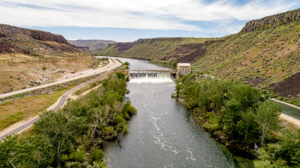 Fototapeta na wymiar Water flows over Diversion Dam on the Boise river in spring
