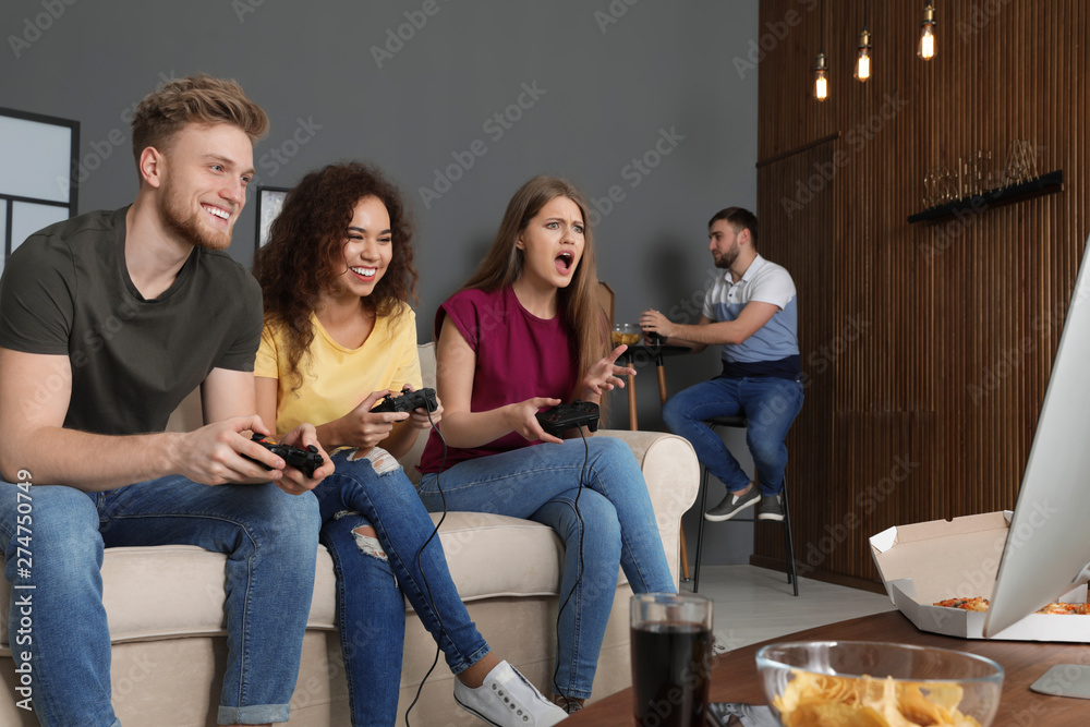 Wall mural emotional friends playing video games at home