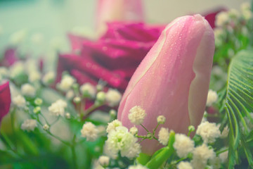 Obraz na płótnie Canvas Pink tulip flower in bouquet on blurred background. Macro photography.