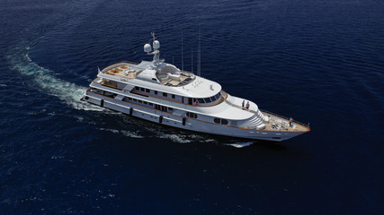 Aerial photo of luxury yacht cruising deep blue open ocean sea