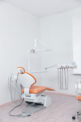 Dentist's office with modern chair and professional equipment
